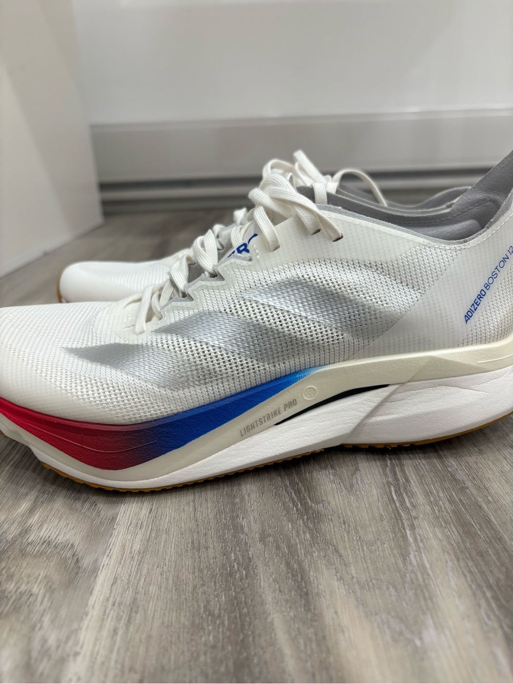 adidas White Athletic Running Shoes with Red and Blue Accents